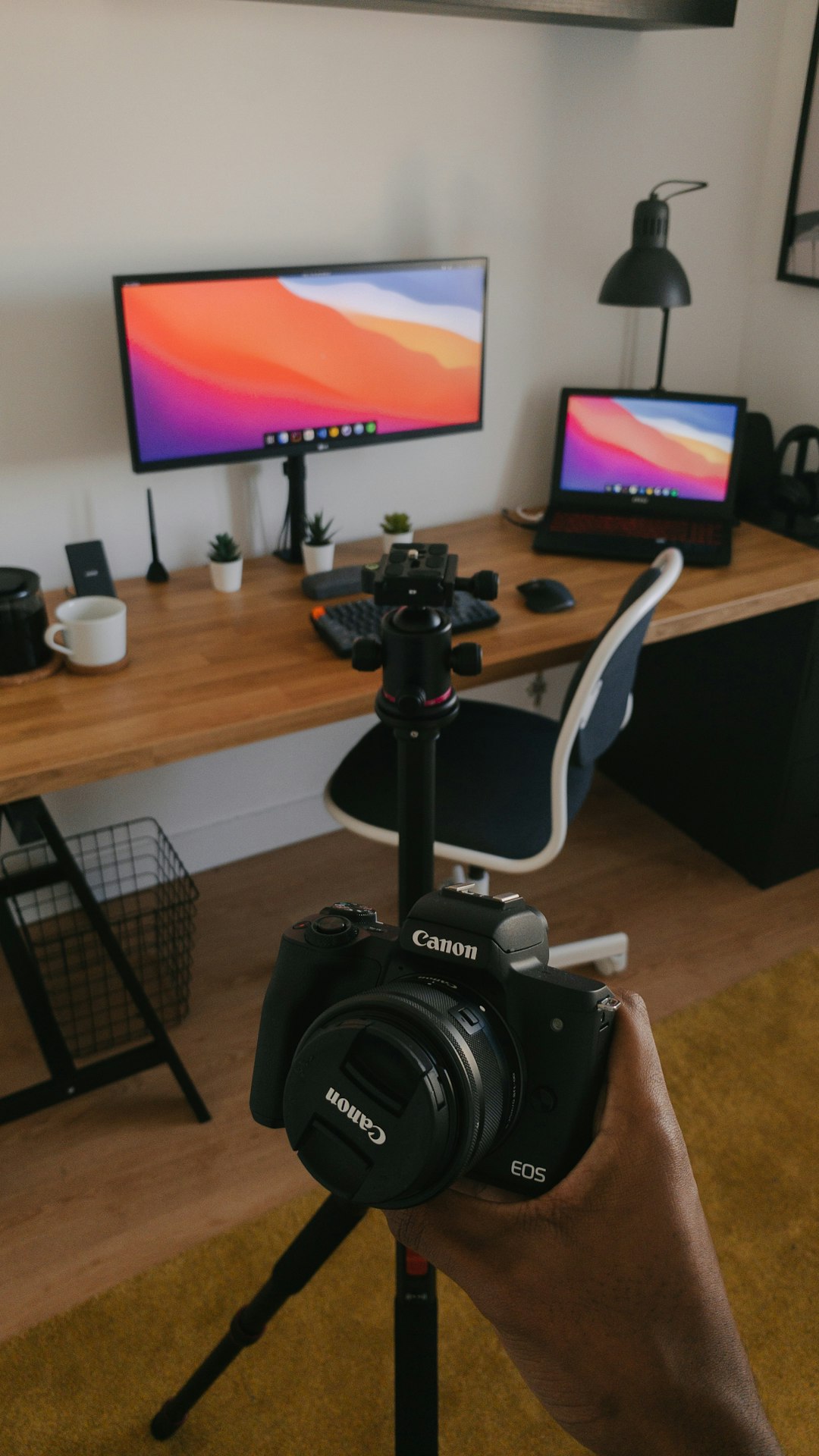 black-nikon-dslr-camera-on-black-tripod-l4b8db-npbm